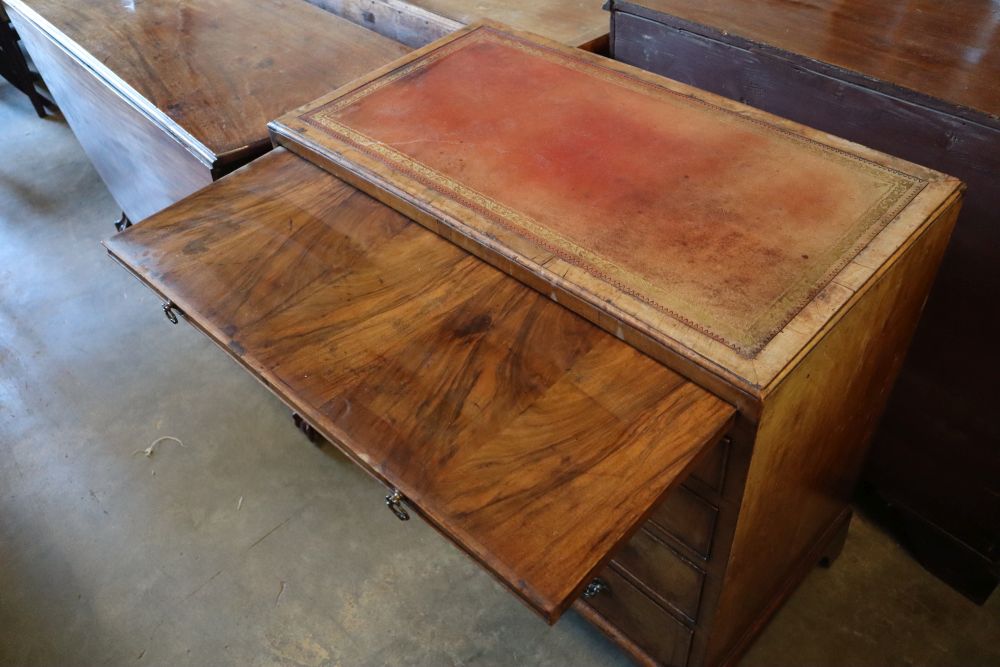 A George I walnut chest, with brushing slide, two short and three graduated long drawers, width 82cm